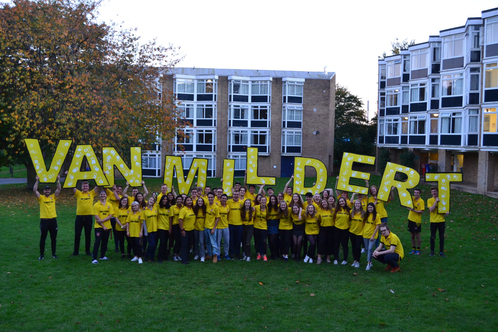 Freps in yellow holding large letters spelling Van Mildert